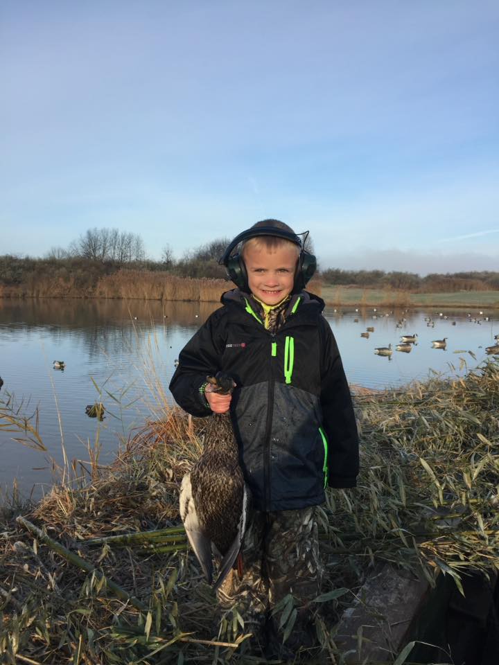 young hunter holding his waterfowl southern illinois