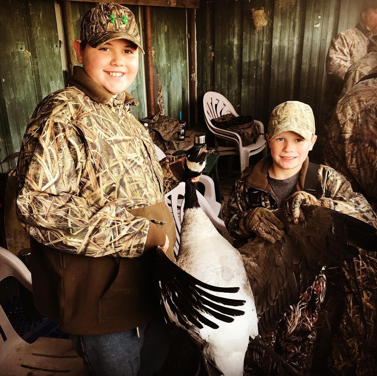 two young canada goose hunters